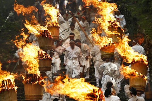 Participants parade with flaming tourches during a festival in Nachikatsuura town, Wakayama prefecture, Japan.