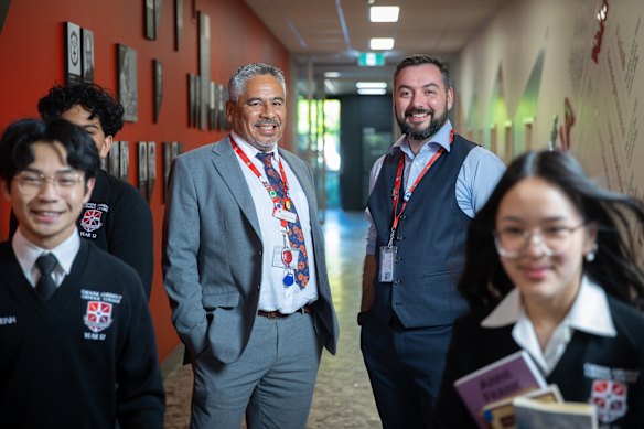 Caroline Chisholm Catholic College principal Napoleon Rodezno with deputy principal Tristan O’Brien and students.