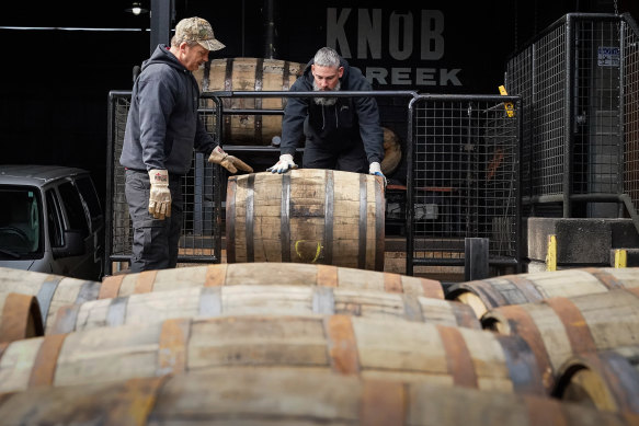 Workers load barrels of bourbon on to a truck at the Jim Beam Distillery in Clermont, Kentucky. 