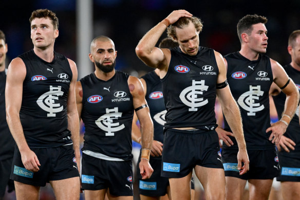 The Carlton Blues look dejected after losing against the Western Bulldogs on Friday.