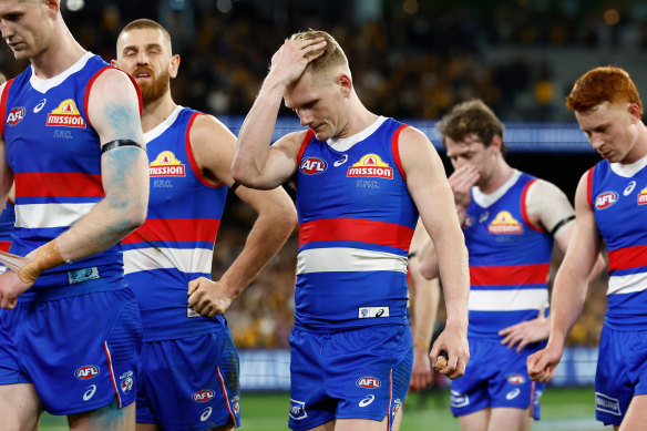 The Dogs trudge off the MCG after last year’s elimination final loss.