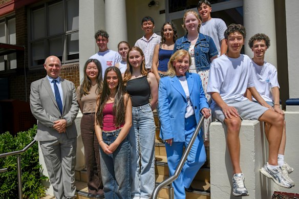 Casimir Catholic College principal Carmelina Eussen (in blue suit) with students after HSC results were released.