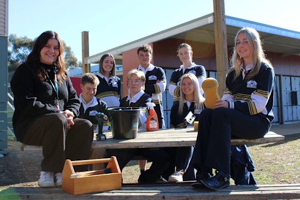 Mansfield Secondary College’s Jade O’Connor with some of the VCE Vocational Major students behind a successful car wash business. 