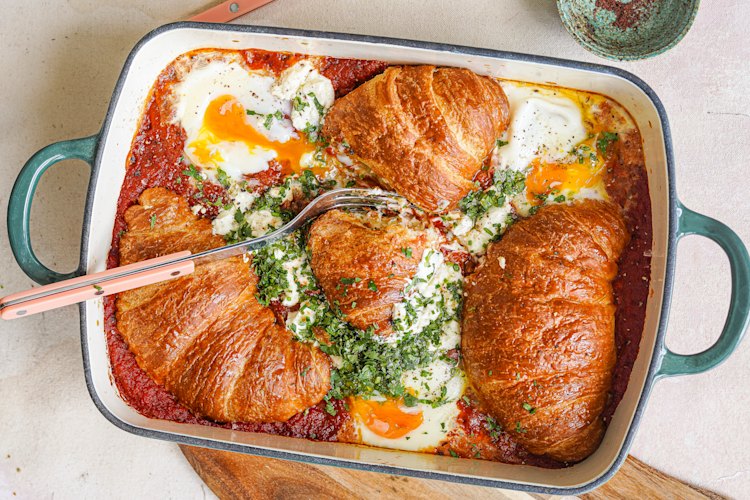 Shakshuka meets savoury bread-and-butter pudding in this share-friendly brunch dish.