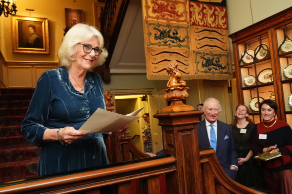 Queen Camilla speaks as King Charles looks on during a reception to mark the launch of the Queen’s reading room medal at Clarence House on Tuesday.