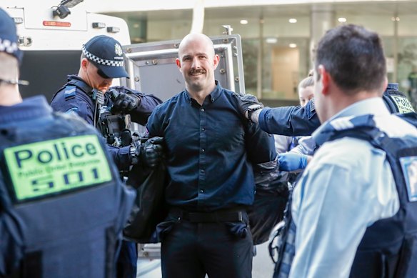 Sewell being arrested outside court on Tuesday.
