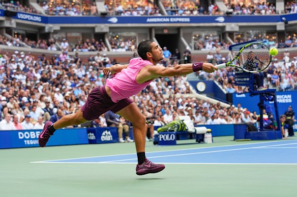 Carlos Alcaraz, of Spain, returns a shot to Novak Djokovic in the semi-final.