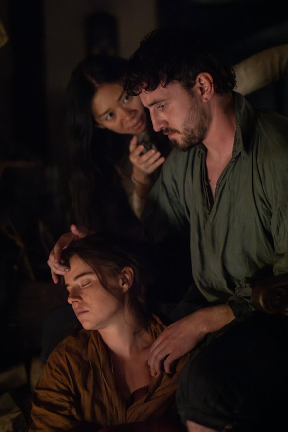 Jessie Buckley and Paul Mescal with director Chloé Zhao on the set of Hamnet.