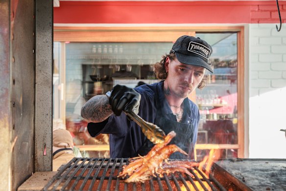Al pastor pork and seafood are grilled on a roaring central wood fire at Mule.