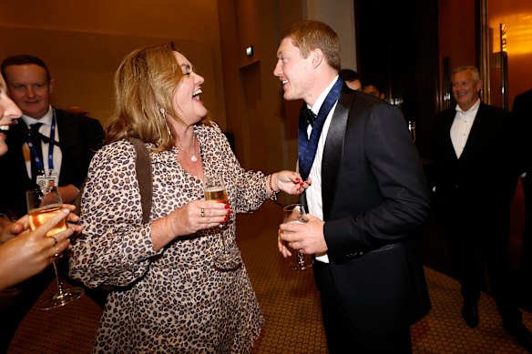Matt Rowell celebrates with his mum, Louise, later in the night.