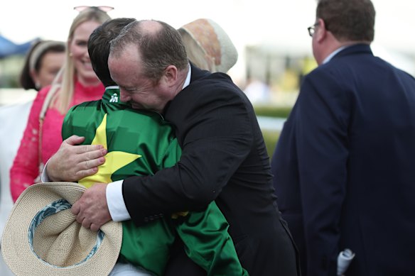 Wayne Hawkes embraces Tyler Schiller after Nepotism’s Champagne Stakes win in April.