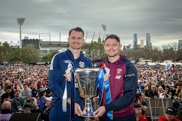 Neale (right) and rival captain Patrick Dangerfield got their hands on the premiership cup on Friday.