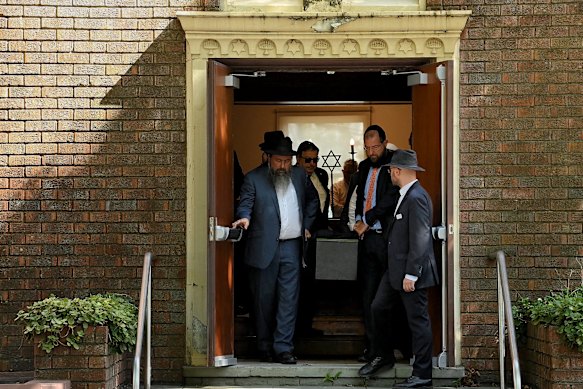 The casket of Bondi massacre victim Alex Kleytman is carried from Sydney Chevra Kadisha where the funeral was held.