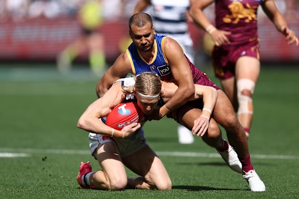 business Brisbane’s Callum Ah Chee makes a tackle on Oliver Dempsey in the grand final.