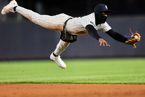 Jazz Chisholm Jr. #13 of the New York Yankees makes a diving catch against the Athletics during the sixth inning at Yankee Stadium on April 08, 2026 in New York City. 