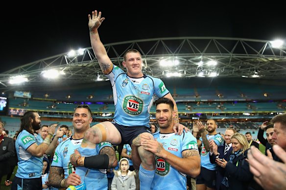 Gallen being chaired off the field after his last State of Origin game in 2016, which the Blues won.