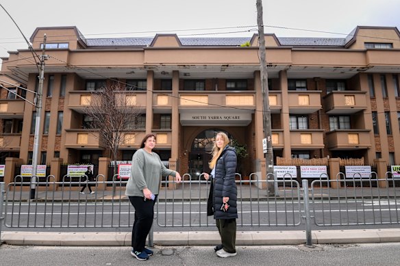 Scherma and South Yarra Square resident Kristen Morgan outside their defective building.