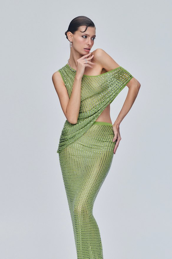 Christopher Esber “Cirrus” dress, $1450. Tiffany & Co “HardWear” earrings, necklace and rings in white gold with diamonds.
