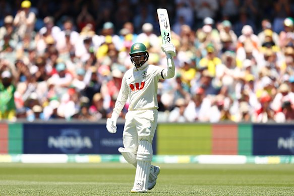 Usman Khawaja brings up his half century. 