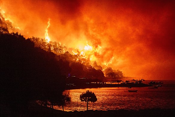 A wildfire approaches a beach on the Adriatic coast near Omis, southern Croatia.