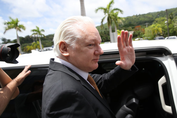 Julian Assange leaving Saipan court.