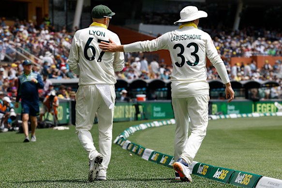 Nathan Lyon is consoled by Marnus Labuschagne at Adelaide Oval on Sunday.