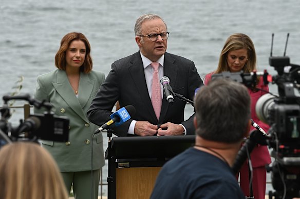 Prime Minister Anthony Albanese, flanked by Communications Minister Anika Wells (left) and eSafety Commissioner Julie Inman Grant yesterday. 