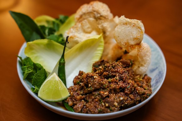 Kangaroo larb tartare dressed in a toasted northern Thai spice mix, with fried beef tendon crackers.