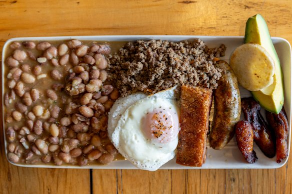  Beans, minced beef, chicharron, chorizo, rice, fried egg, plantain, avocado and a mini arepa.
