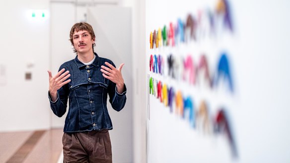 Curator Michael Gentle with “Boomerangs”, an installation by Keemon Williams.
