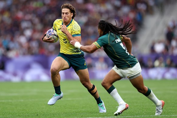 Mark Nawaqanitawase playing for Australia at the Paris Olympics during the Sevens semi-final against South Africa.
