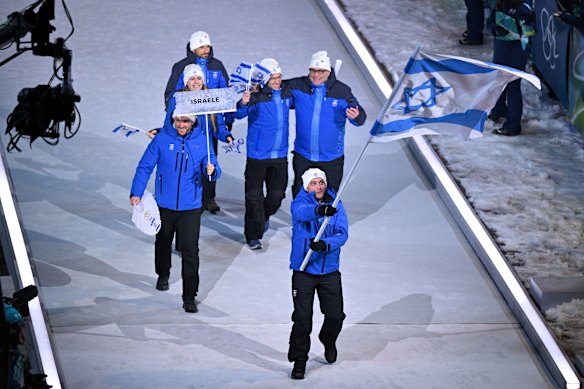 Jared Firestone carries the flag for Israel at the opening ceremony.