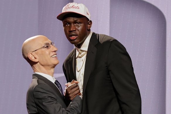 Khaman Maluach reacts as he greets NBA commissioner Adam Silver after being drafted.