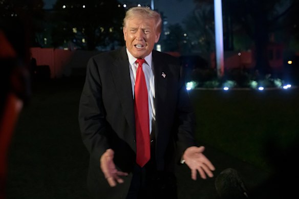 US President Donald Trump talks with reporters upon arrival at the White House in Washington on Sunday. 