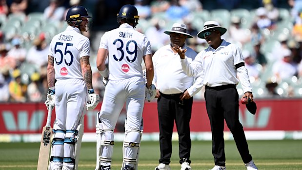  England’s Ben Stokes and Jamie Smith speak to umpires Ahsan Raza and Nitin Menon.