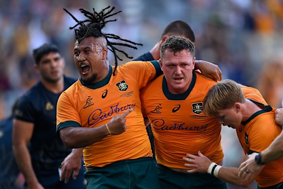 Angus Bell and the Wallabies celebrate the match-winning try against Argentina in Townsville.