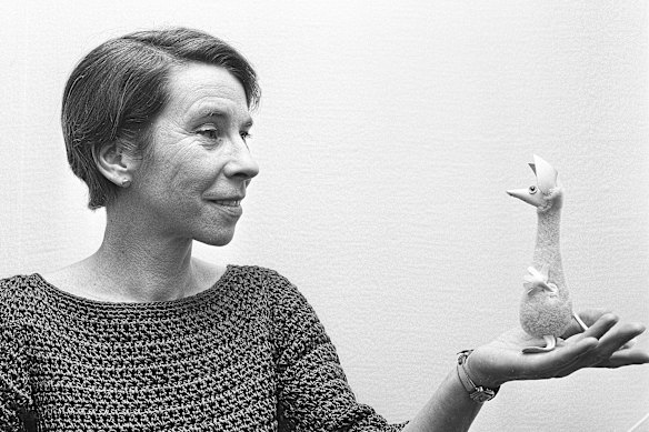 Moomins creator Tove Jansson with a sculpture of one of her creations.