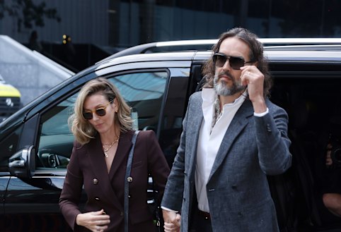 Brand, who is on bail, left the court building beside the River Thames holding hands with his wife, Laura Gallacher.