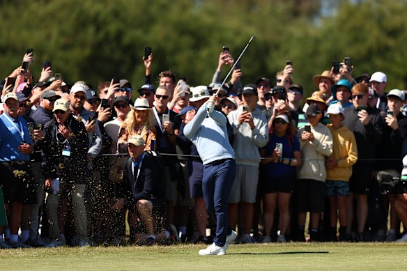 Rory McIlroy of Northern Ireland plays his second shot on the first hole.