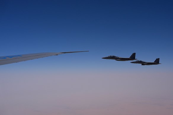 Royal Saudi Air Force F-15s provide an honorary escort for Air Force One.