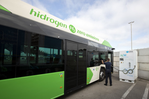 A driver fills the tank of an urban bus with green hydrogen at the bus depot of the municipal transport company in Palma de Mallorca.