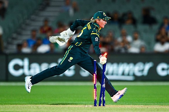 Australian keeper Beth Mooney completes the run out of Amanjot Kaur towards the end of India’s innings.