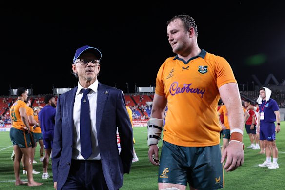 Coach Les Kiss and captain Harry Wilson show their relief after the Wallabies escaped with victory in Japan.