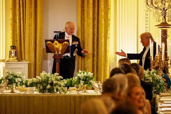 Trump gestures as the King speaks at the state dinner.
