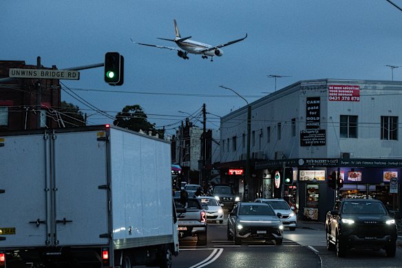 An aircraft takes a low path over Sydenham.