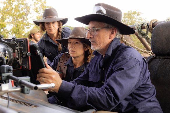 Greg Mclean, right, and Anna Torv, centre, watch a scene on a monitor while shooting the show in the Northern Territory.