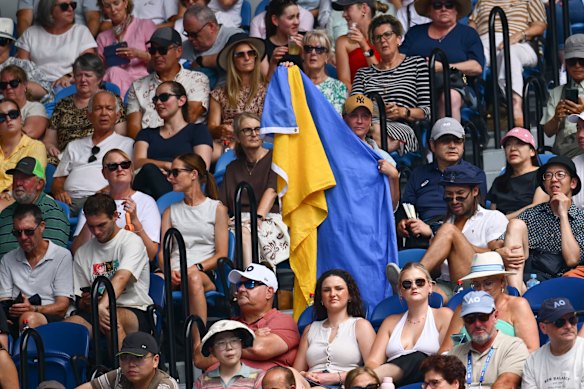 A fan waves a Ukranian flag during Elina Svitolina’s fourth-round clash with Veronika Kudermetova last year.
