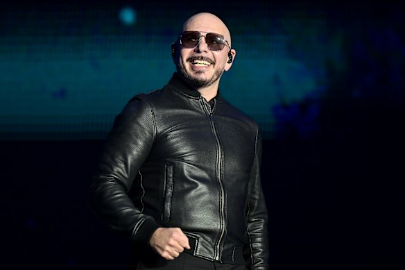 Pitbull, pictured here in Texas in April, says seeing fans dress as him en masse is “an honour”.