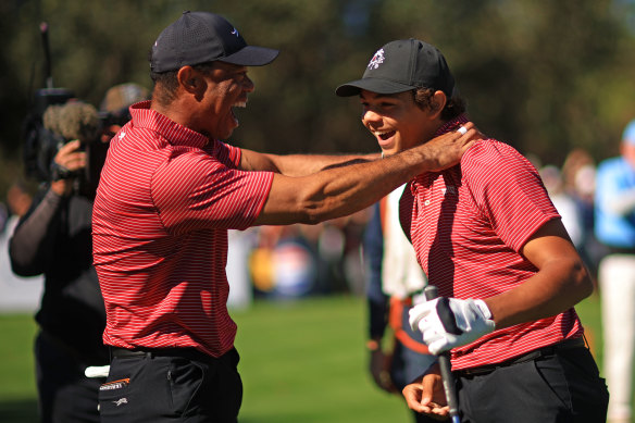 Tiger and Charlie Woods celebrate the 15-year-old’s hole-in-one.