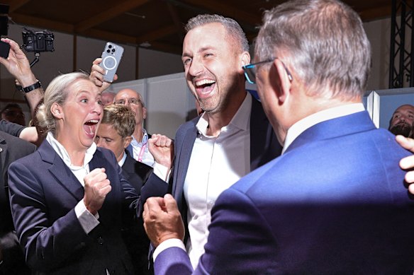 Ulrich Siegmund (centre) celebrates his likely win. 